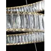 Żyrandol Kryształowy Złoty Crystal XL Trzypoziomowy przy oknie. Naturalne światło i elegancja od Primavera Home.