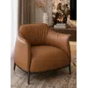 Nowoczesny wygodny fotel luksusowy do salonu z podnóżkiem MODERN w ujęciu z przodu. Oświetlenie na zamówienie od Primavera Home.