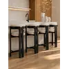 Nowoczesny hoker drewniany na ciemnym stelażu tapicerowany FOREST w jasnym wnętrzu. Ekspozycja w salonie od Primavera Home.