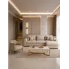 Ekspozycja nowoczesnego wygodnego fotela luksusowego do salonu z podnóżkiem MODERN w showroomie. Meble na zamówienie od Primavera Home.