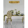 Detale designerskiego stołu do jadalni, glamour, ze szklanym blatem, stalowego, złotego ELITE w zbliżeniu. Meble na zamówienie od Primavera Home.