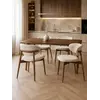 Designerskie Krzesło Drewniane Olivia – Nowoczesne na tle roślin. Meble na zamówienie od Primavera Home.