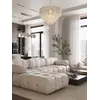 Ekspozycja pełna designerskiego narożnika modułowego boucle NICEA w nowoczesnym wnętrzu. Meble na zamówienie od Primavera Home.