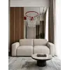 Luksusowa nowoczesna sofa rozkładana do salonu MODERNO w jasnym wnętrzu, harmonijnie wkomponowana w przestrzeń. Meble na zamówienie od Primavera Home.