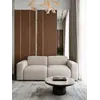 Luksusowa nowoczesna sofa rozkładana do salonu MODERNO z boku, prezentująca elegancki kształt. Detal wykończenia od Primavera Home.