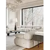 Detal poduszek designerskiego narożnika modułowego boucle NICEA w aranżacji nowoczesnego wnętrza. Primavera Home.