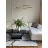 Stylizacja salonu z wykorzystaniem designerskiego narożnika modułowego boucle NICEA. Oferowane przez Primavera Home.