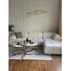 Widok na designerski narożnik modułowy boucle NICEA przy dużym oknie. Meble na zamówienie od Primavera Home.
