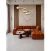 Widok boczny prezentujący designerski narożnik modułowy boucle NICEA w nowoczesnym wnętrzu. Meble na zamówienie w Primavera Home.