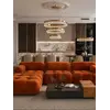 Aranżacja nowoczesnego wnętrza z designerskim narożnikiem modułowym boucle NICEA. Meble na zamówienie od Primavera Home.