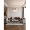 Nowoczesna aranżacja z wykorzystaniem sofy w przestronnej stylistyce salonu. Meble na zamówienie od Primavera Home.