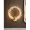 Kinkiet Kryształowy ICE ROUND w ekspozycji w showroomie Primavera Home, eksponujący jego elegancję.