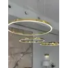Widok z góry na lampę glamour led GALASSIA okrągła z połyskiem ringi, regulowana, nowoczesna, loft do salonu złota OUTLET. Meble na zamówienie od Primavera Home.