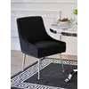 Czarne krzesło tapicerowane glamour z kołatką Paloma w jasnym wnętrzu. Ekspozycja w salonie od Primavera Home.