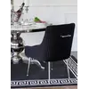 Widok od tyłu na czarne krzesło tapicerowane glamour z kołatką Paloma. Detal wykończenia od Primavera Home.