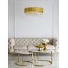 Luksusowa złota sofa pikowana DIVA GOLD z widokiem na siedzisko, ukazująca komfort. Meble na zamówienie od Primavera Home.