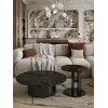 Stolik kawowy TWEEN BLACK stylizowany na tle roślinności. Ekspozycja w salonie od Primavera Home.