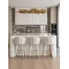 Zbliżenie na siedzisko hokera. Detal wykończenia przyciągający wzrok dzięki eleganckiemu stylowi od Primavera Home.