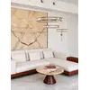 Sofa narożna z półką w nowoczesnej galerii wnętrz, ukazująca swój wyjątkowy design od Primavera Home.