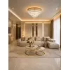 Trójwymiarowy widok na stolik kawowy okrągły glamour MARCO GOLD, eksponujący jego elegancki kształt i styl. Aranżacja nowoczesnego wnętrza od Primavera Home.
