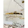 Złoty Żyrandol Kryształowy Bellini eksponowany w showroomie. Aranżacja nowoczesnego wnętrza od Primavera Home.