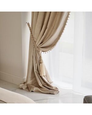 Exclusive curtain richly decorated with haberdashery