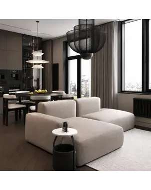 Aranżacja okrągłego stolika kawowego Tavolino w nowoczesnym salonie. Projekt od Primavera Home.