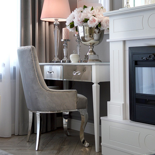 Upholstered chair upholstered on steel flexible legs to the salon TIFFANY silver 