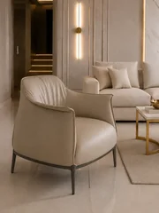 Designerski nowoczesny fotel luksusowy do salonu do gabinetu z podnóżkiem MODERN