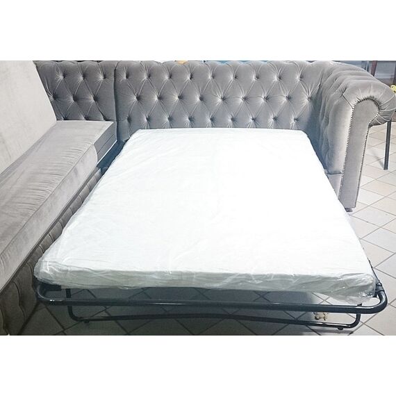 Chesterfield corner sofa with fold-out bedroom function, upholstered in glamour style