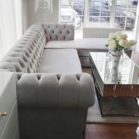 Chesterfield corner sofa with fold-out bedroom function, upholstered in glamour style