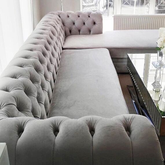 Chesterfield corner sofa with fold-out bedroom function, upholstered in glamour style