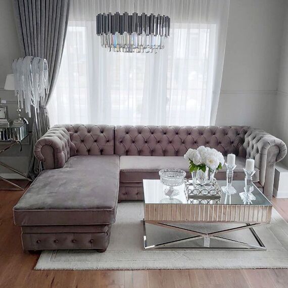Chesterfield corner sofa with fold-out bedroom function, upholstered in glamour style