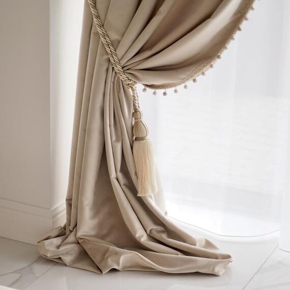 Exclusive curtain richly decorated with haberdashery