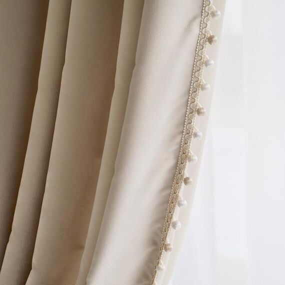 Exclusive curtain richly decorated with haberdashery