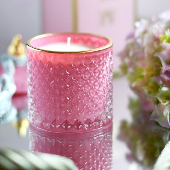 Decorative scented candle in a glass crystal container, rose gold