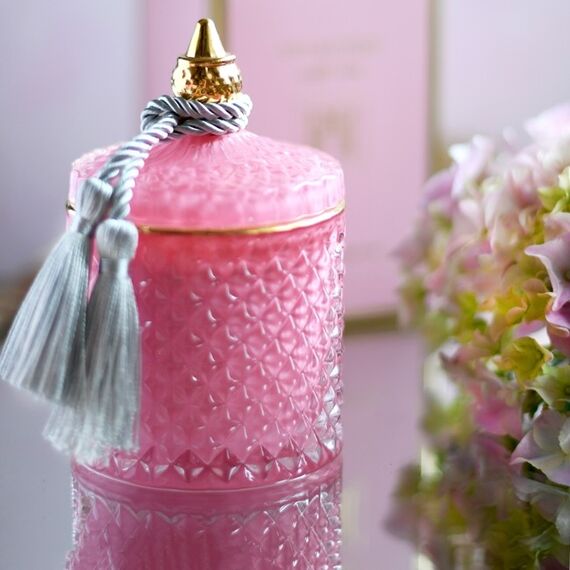 Decorative scented candle in a glass crystal container, rose gold