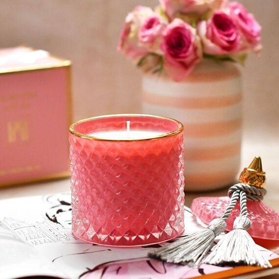 Decorative scented candle in a glass crystal container, rose gold