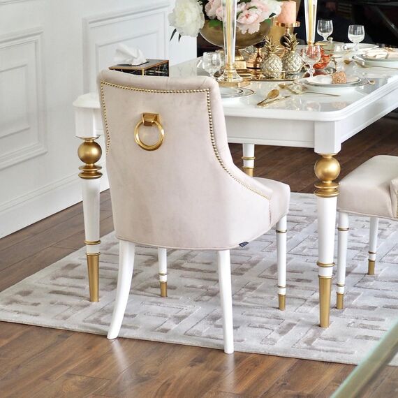 Modern, golden PRINCE glamor chair with a knocker for the dining room