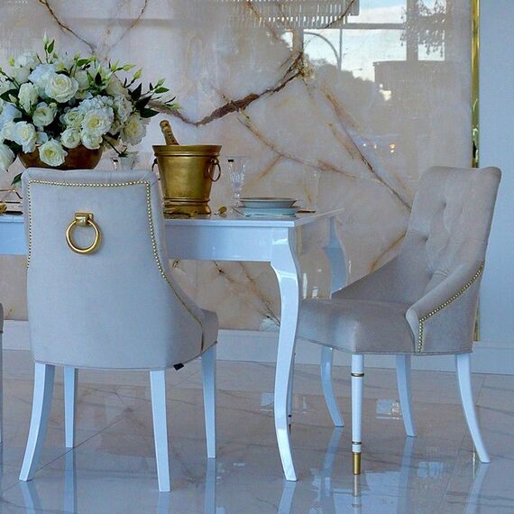 Modern, golden PRINCE glamor chair with a knocker for the dining room