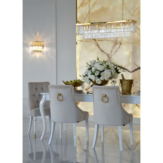Modern, golden PRINCE glamor chair with a knocker for the dining room