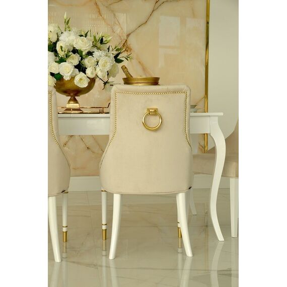 Modern, golden PRINCE glamor chair with a knocker for the dining room
