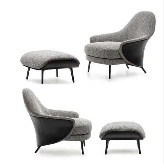Modern, upholstered designer armchair on black legs with a LINEA footstool