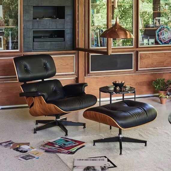 Exclusive, comfortable, modern black leather armchair with LOUNGE footstool