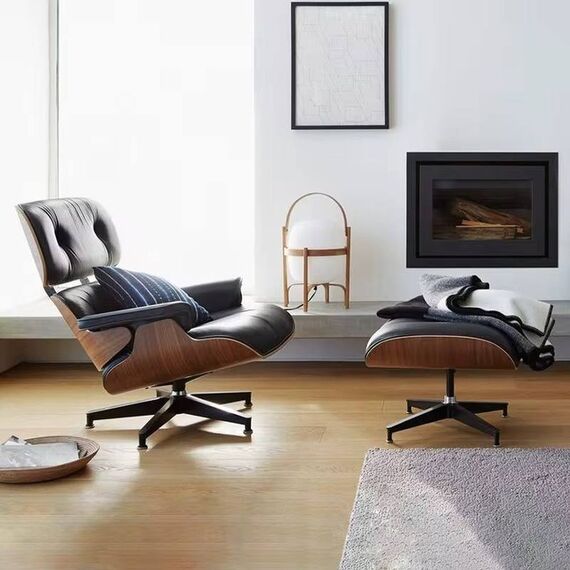 Exclusive, comfortable, modern black leather armchair with LOUNGE footstool