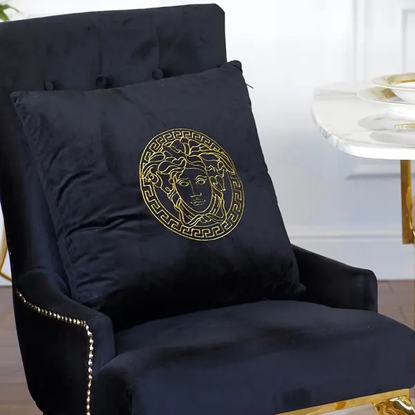 Decorative black velvet pillow with gold logo Medusa