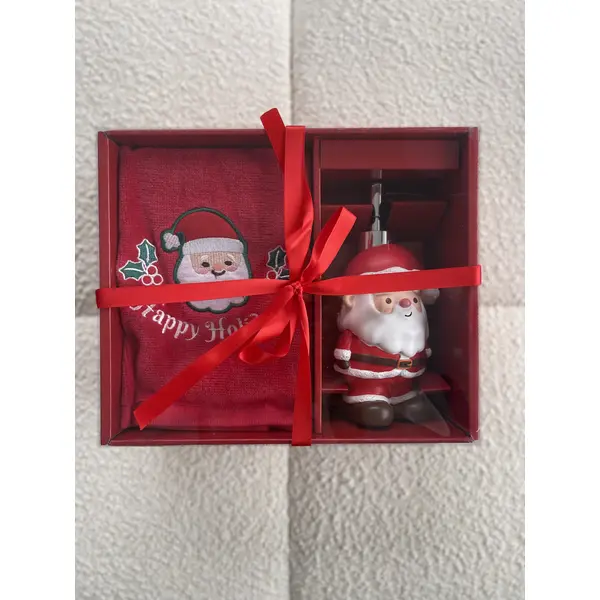 Soap dispenser in the shape of Santa Claus with a towel included