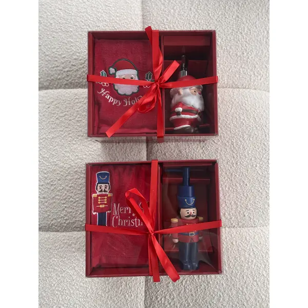 Soap dispenser in the shape of Santa Claus with a towel included