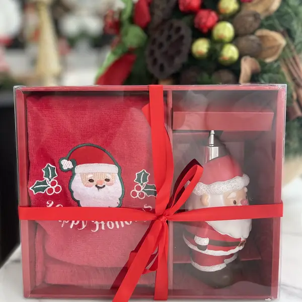 Soap dispenser in the shape of Santa Claus with a towel included