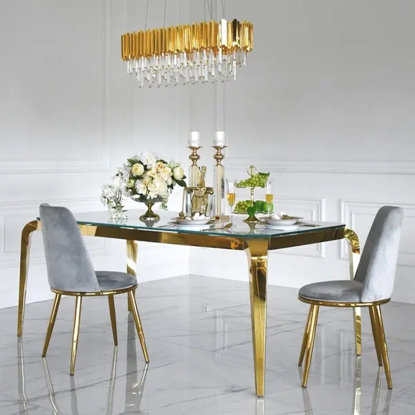 Designer dining table, glamor, with a glass top, steel, gold ELITE OUTLET